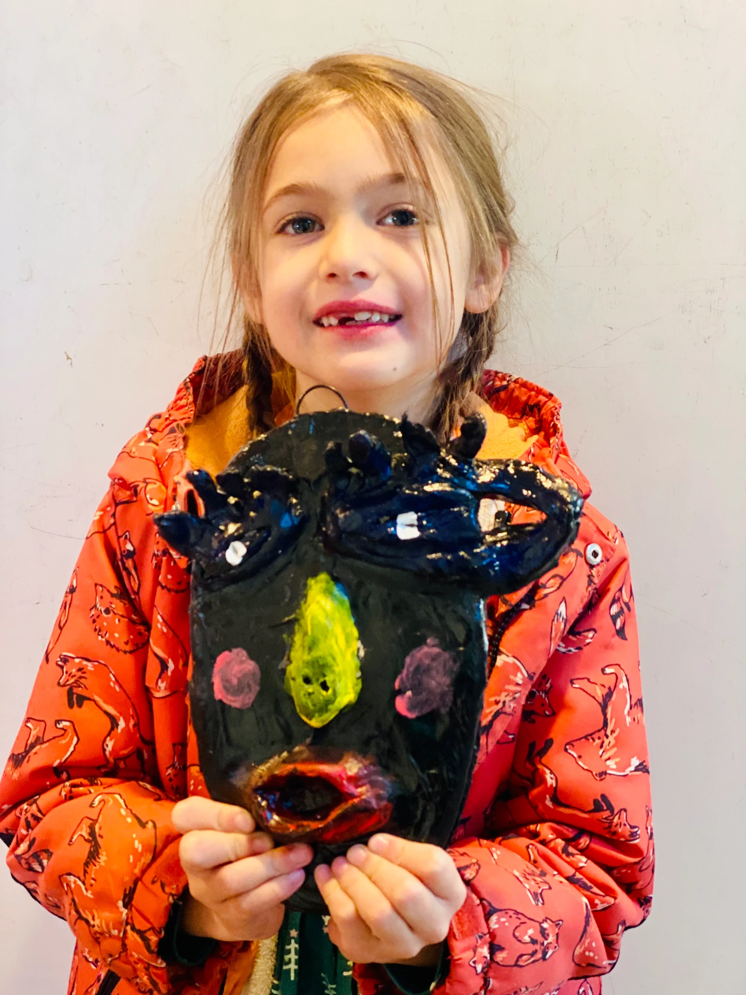 young boy artist holding artwork of a lady in cool style