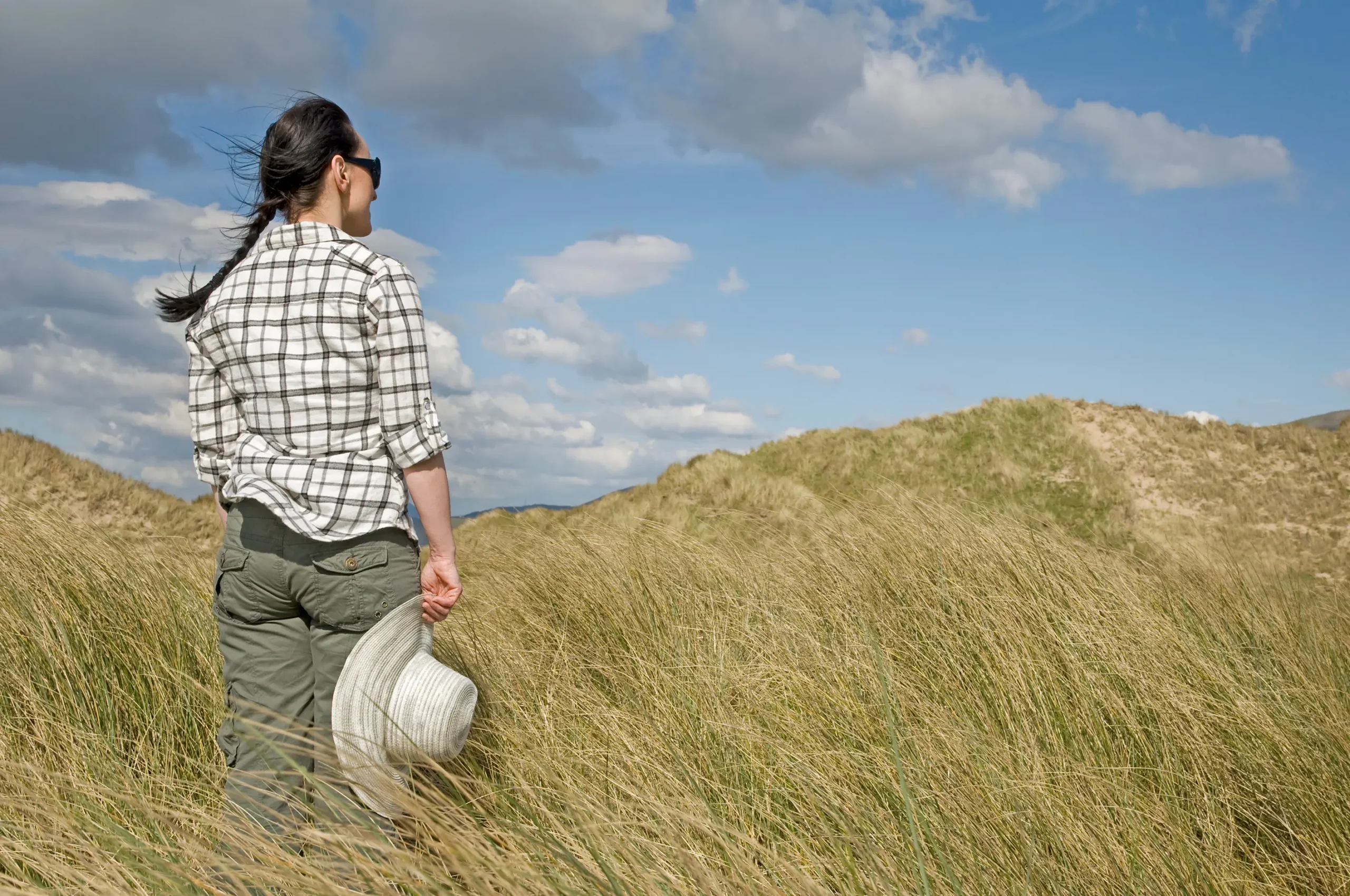 Woman in Field looking at scenery
