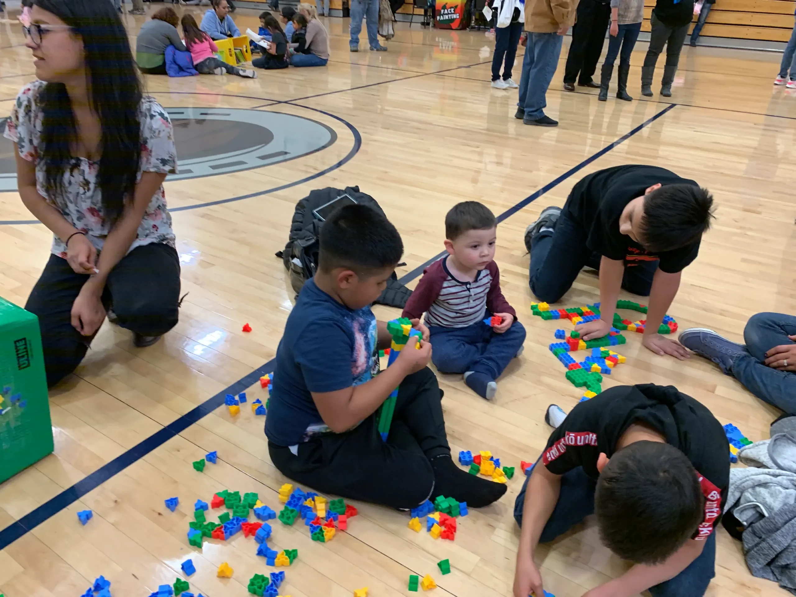 School STEM Family Night, children playing a game with snap blocks