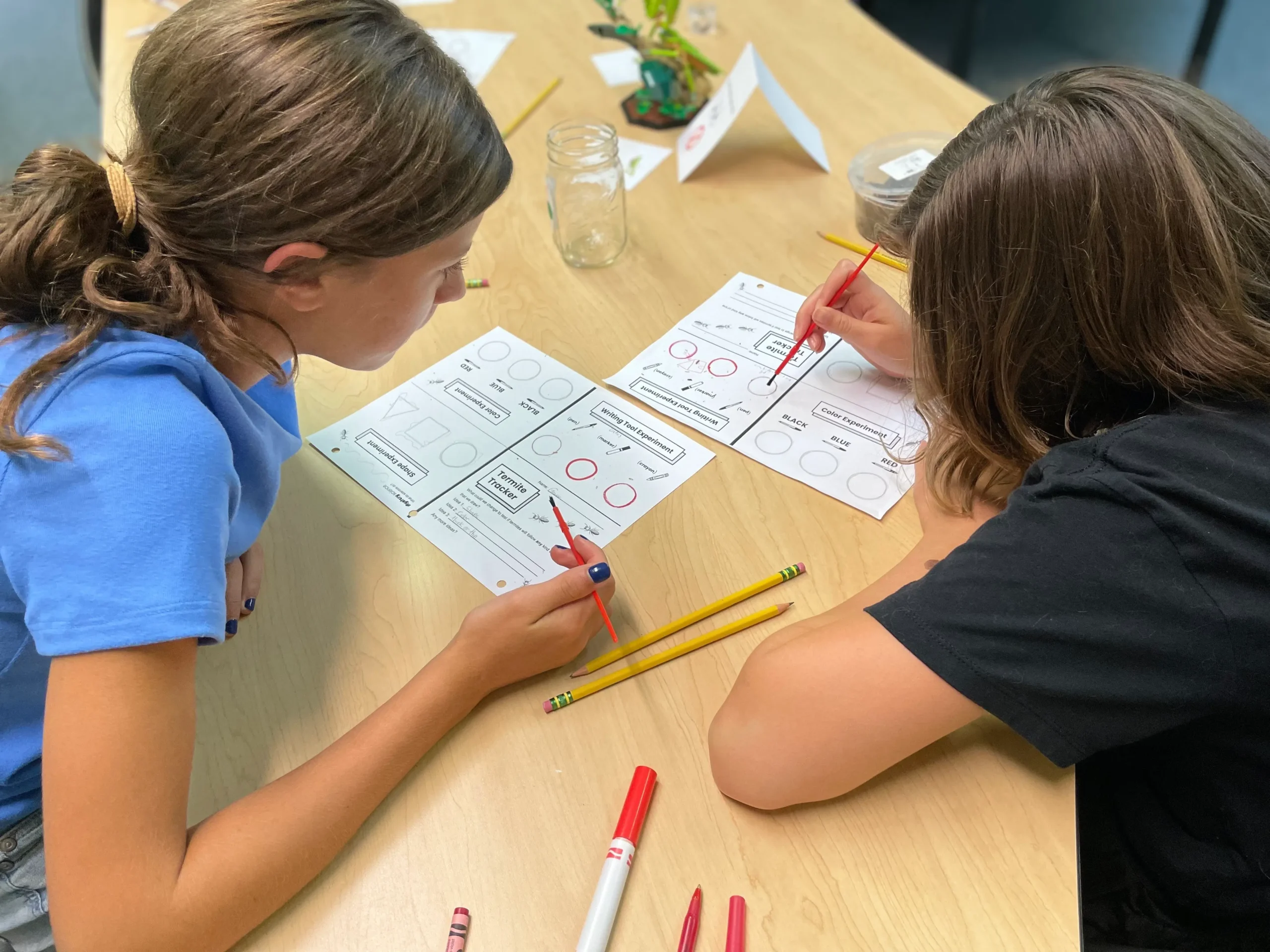 Middle school students work together on assignments. Middle school students work together on assignments.