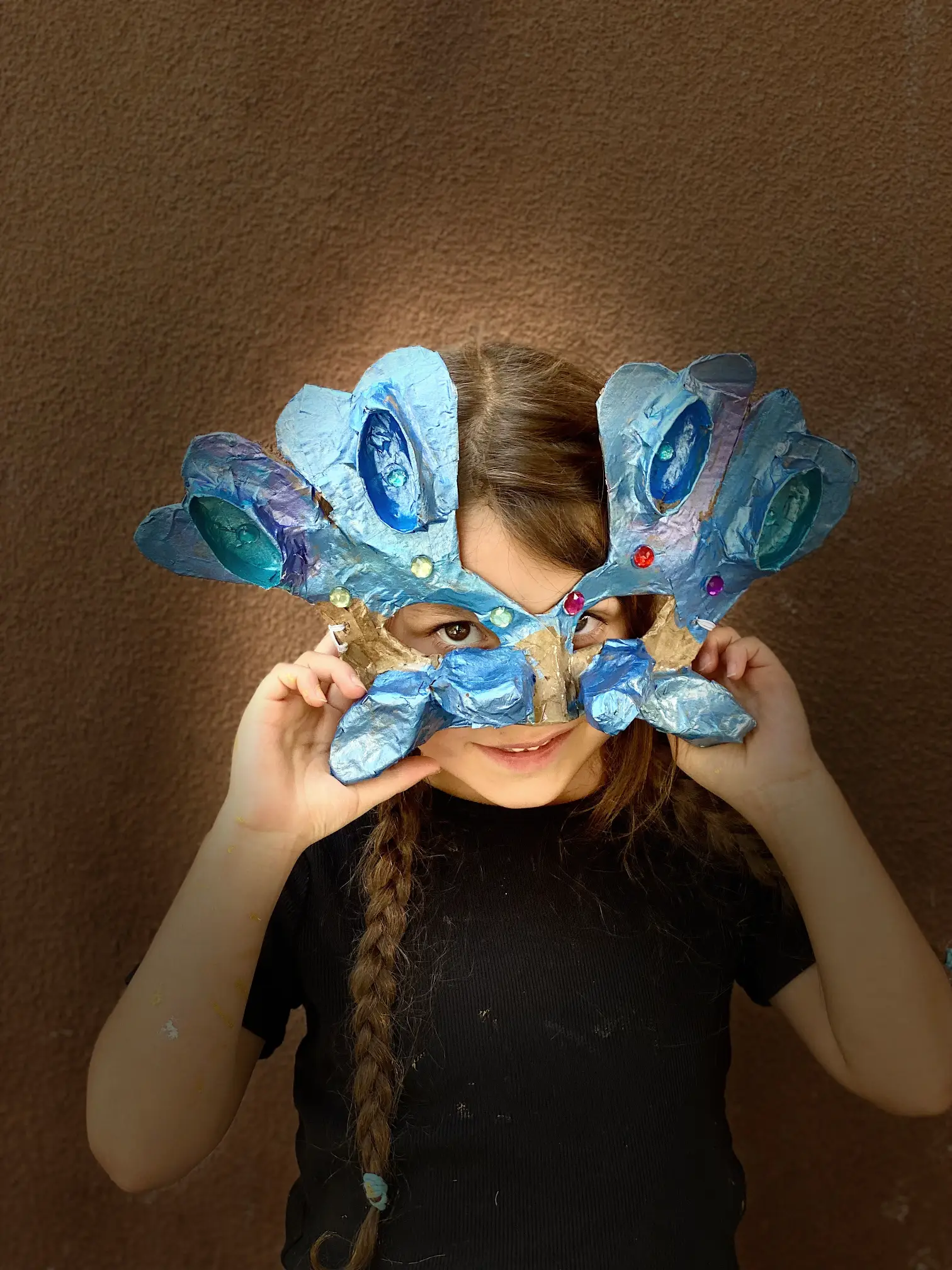 student shows off home made mask