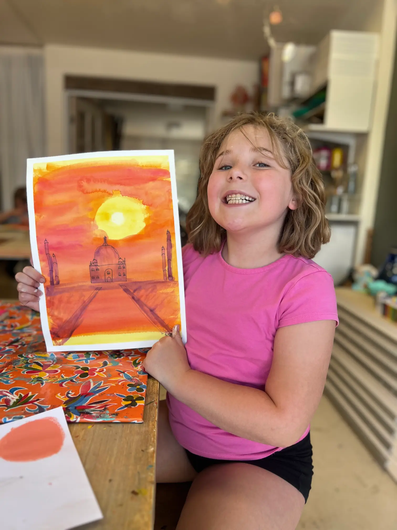 student proud of her artwork