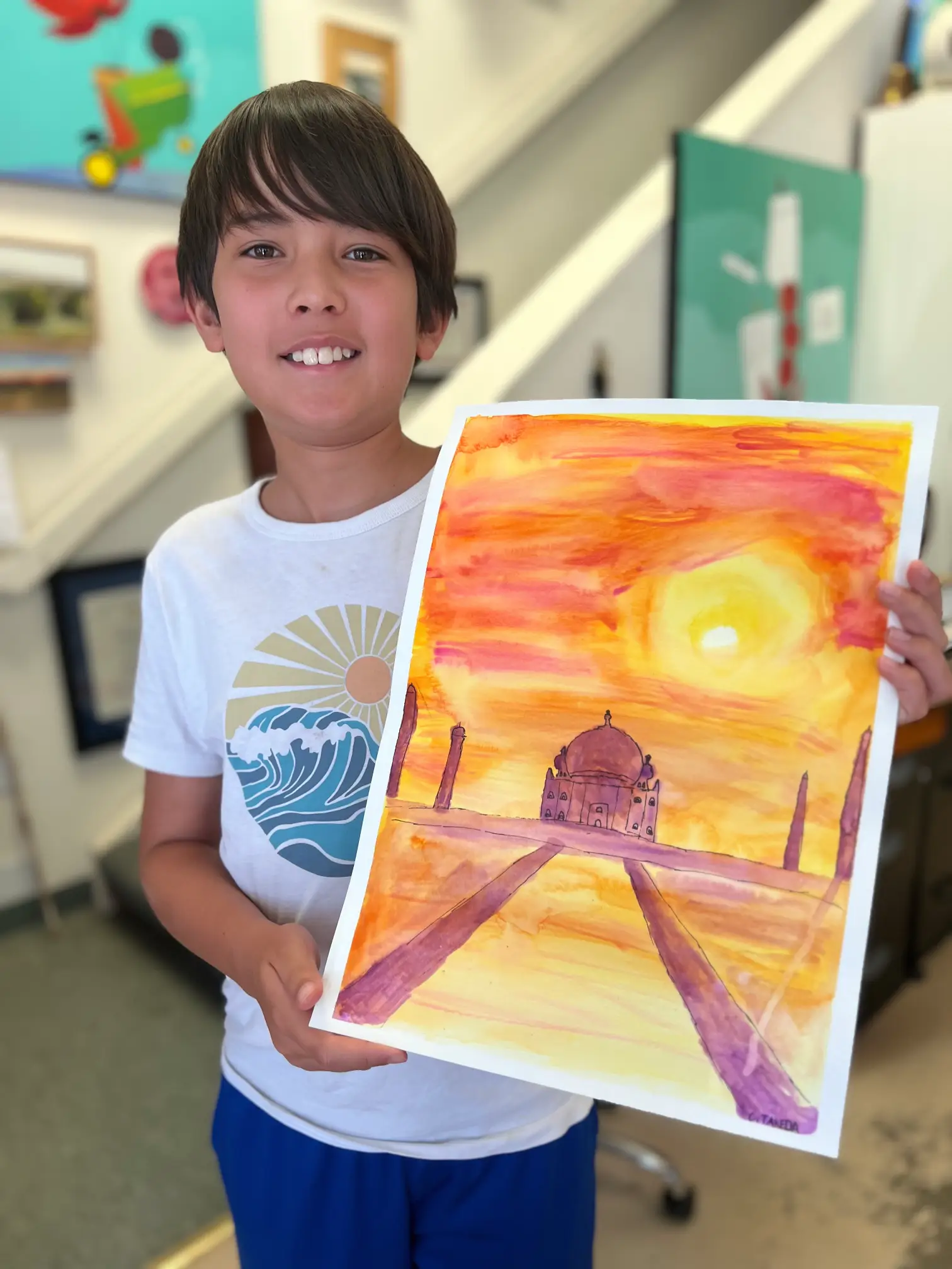 student shows off artwork