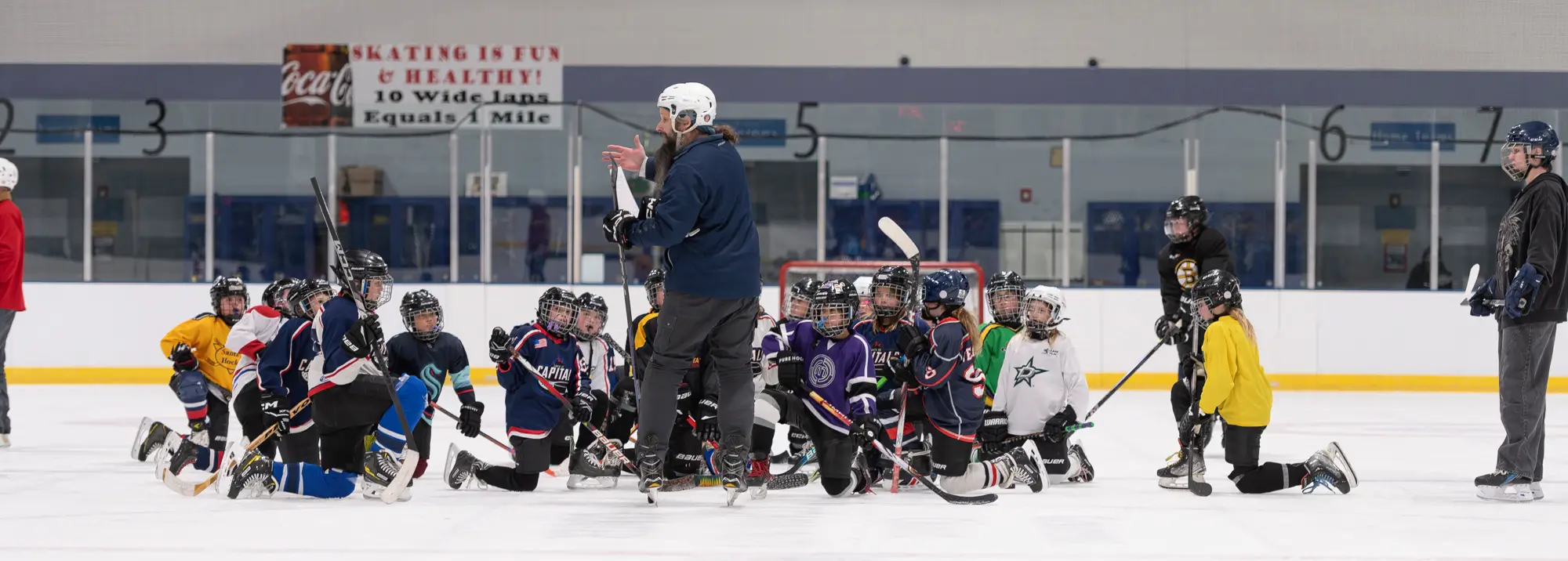 Coach talking to hockey team